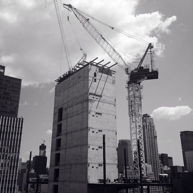 black and white images of building being constructed